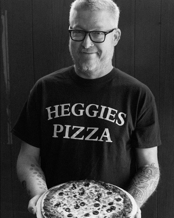 Chef Doug Flicker Holding a el pizza